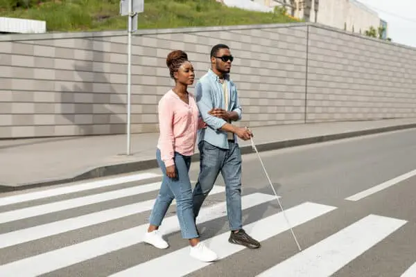 young-black-woman-assisting-visually-impaired