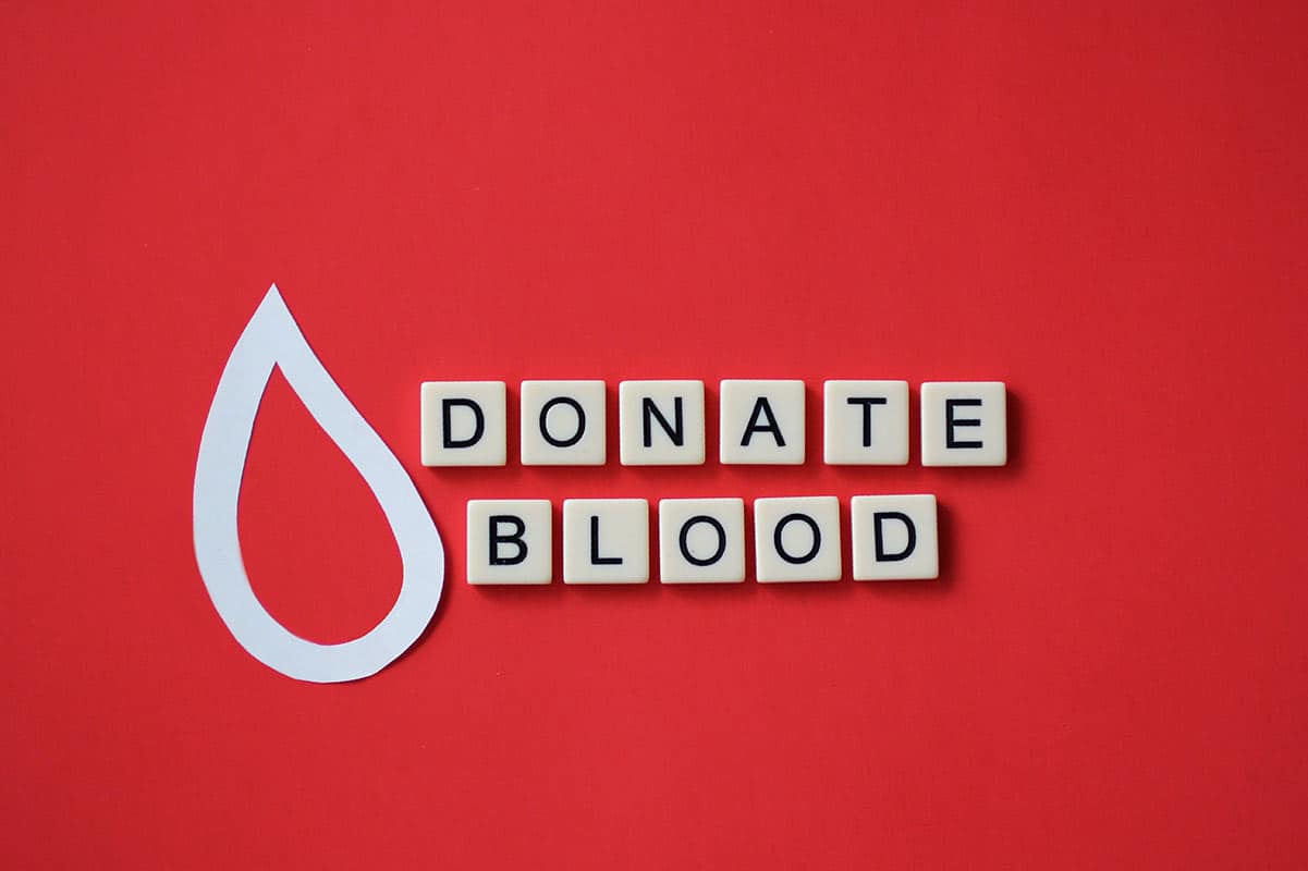 overhead-of-tiles-with-donate-blood-phrase-spelled-SZAJ4QE.jpg